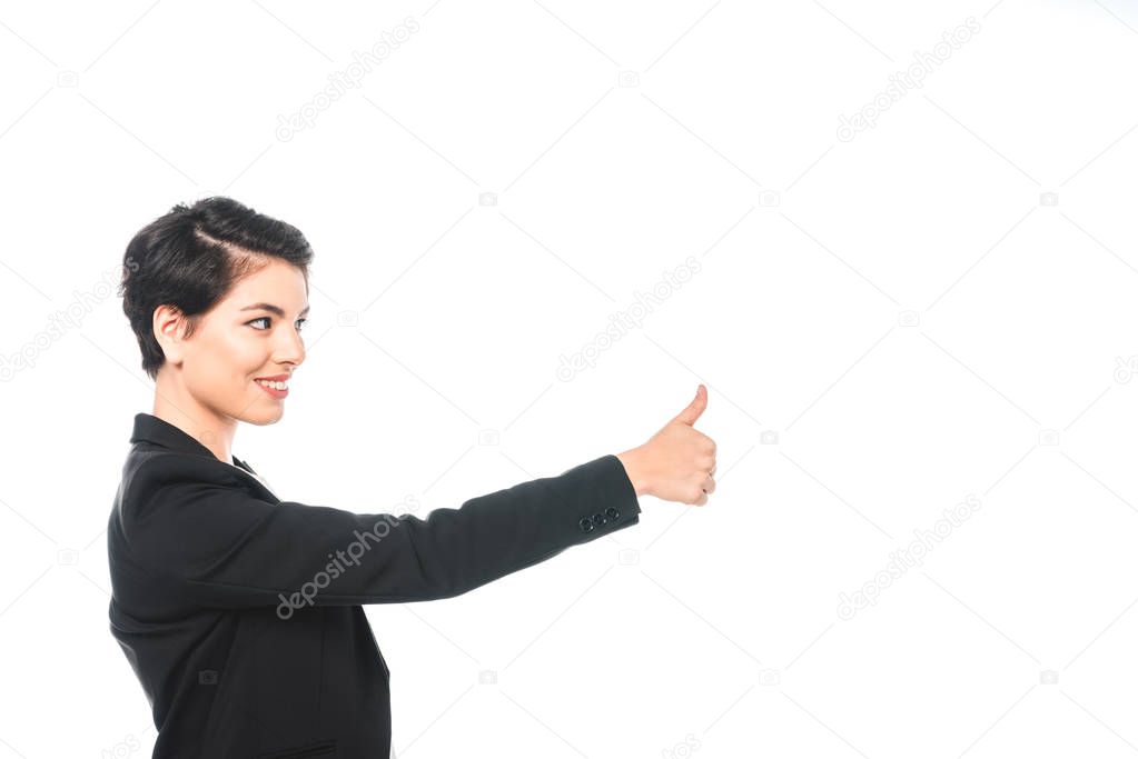 pretty mixed race businesswoman smiling and showing thumb up isolated on white