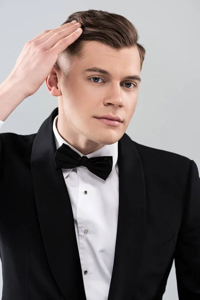 Smiling Young Man Formal Wear Bow Tie Touching Hair Isolated — Stock Photo, Image