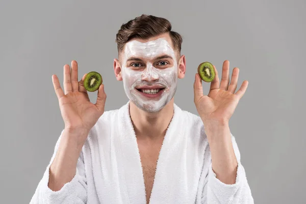 Front View Smiling Man Bathrobe Holding Cut Kiwi Isolated Grey — Stockfoto