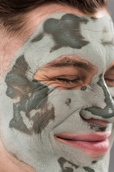 Close View Smiling Young Man Clay Mask Closed Eyes — Stock Photo, Image