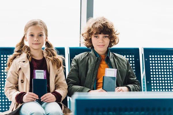 Kids Sitting Blue Chairs Holding Passports Tickets Waiting Hall Airport — Stock Photo, Image