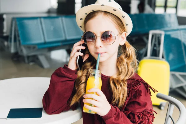 Preteen Kid Drinking Orange Juice Talking Smartphone Waiting Hall — Stock Photo, Image