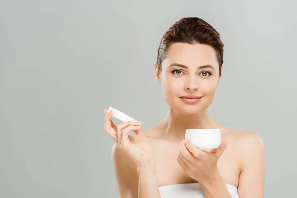 Positive Woman Holding Container Cosmetic Cream Isolated Grey — Stock Photo, Image