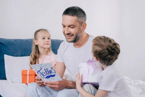 Cute Daughter Son Sitting Gift Boxes Smiling Dad Holding Fathers — Stock Photo, Image