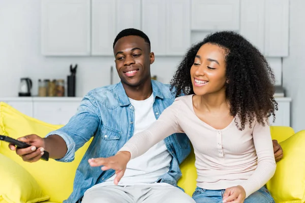 African American Man Holding Remote Controller Hand Spending Weekend Girlfriend — Stock Photo, Image