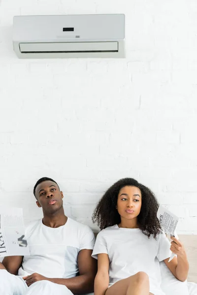 Tired African American Man Woman Newspapers Hands Sitting Bed Room — Stock Photo, Image