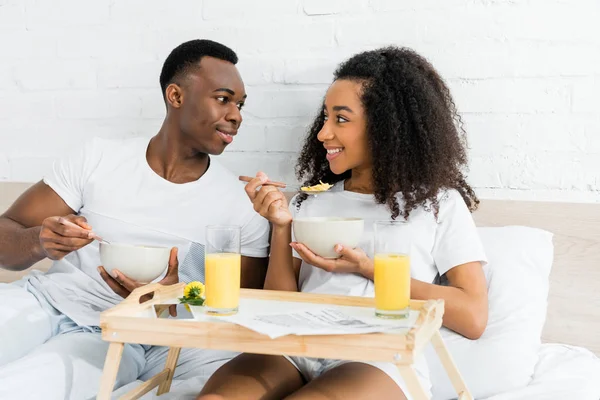 Happy African American Couple Lying Bed Looking Each Other Eating — Stock Photo, Image