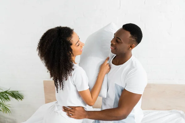Cheerful African American Couple Fighting White Room Holding Pillows Hands — Stock Photo, Image
