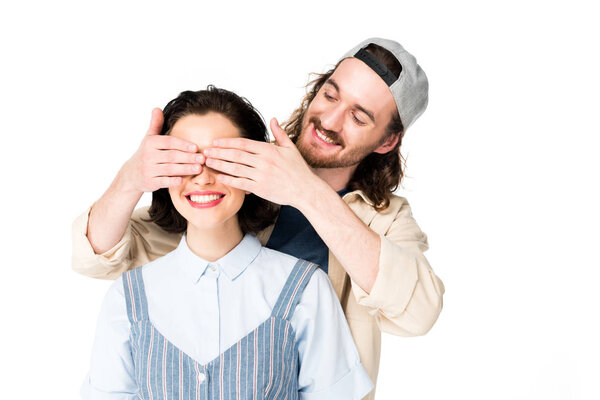 young man closing eyes to girl, who smiling with joy isolated on white