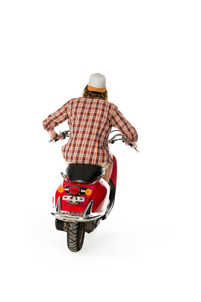 back view of young man sitting on red scooter isolated on white