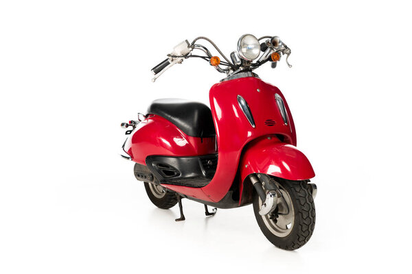 clean, new, red scooter isolated on white