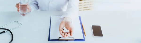 Panoramic Shot Doctor Handful Pills Glass Water Sitting Workplace Clipboard — Stock Photo, Image