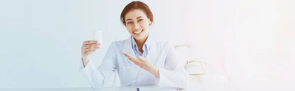 Panoramic Shot Smiling Latin Doctor Pointing Hand Container Pills — Stock Photo, Image