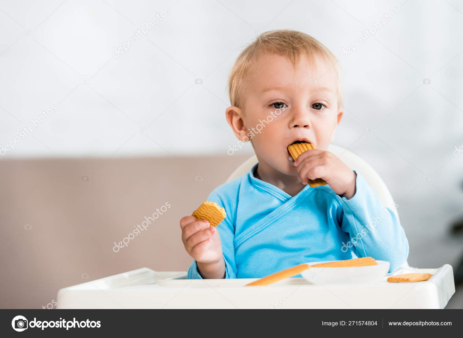 Cute Toddler Kid Sitting Feeding Chair Eating Sweet Cookies Home