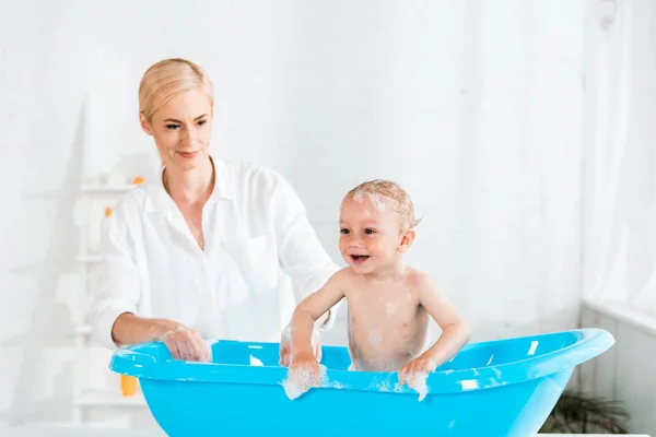 Happy Blonde Mother Looking Cheerful Toddler Kid Bathroom — Stock Photo, Image