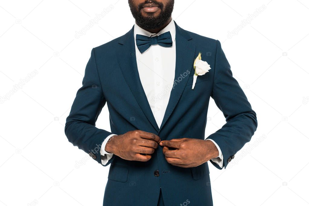 cropped view of bearded african american man touching suit isolated on white 