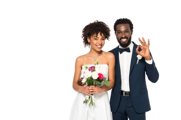 Happy African American Bride Holding Bouquet Bridegroom Showing Sign Isolated — Stock Photo, Image