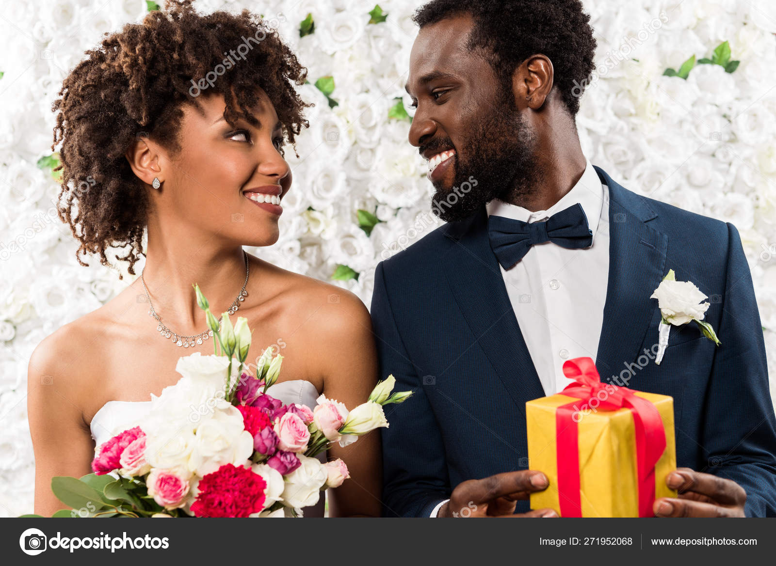 https://st4.depositphotos.com/12982378/27195/i/1600/depositphotos_271952068-stock-photo-cheerful-african-american-bride-holding.jpg