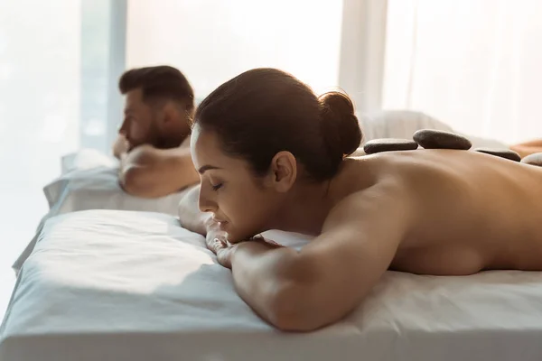 Selective Focus Brunette Woman Closed Eyes Having Stone Massage Man — Stock Photo, Image
