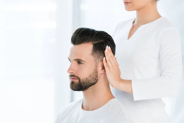 Cropped View Healer Holding Hands Head Handsome Man — Stock Photo, Image