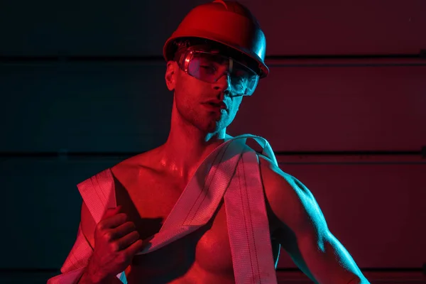 Sexy Shirtless Fireman Protective Helmet Holding Fire Hose Darkness — Stock Photo, Image