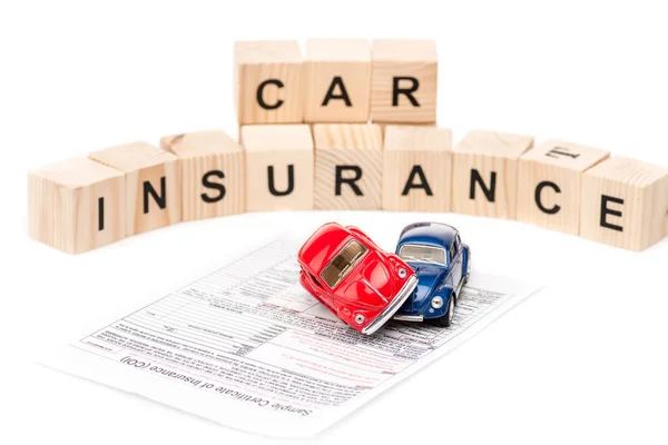 Selective Focus Toy Cars Wooden Blocks Letters Insurance Certificate Isolated — Stock Photo, Image