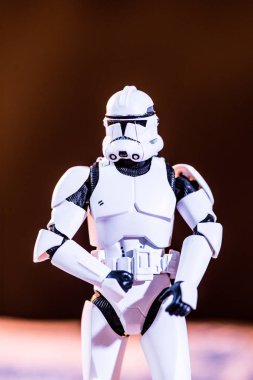white plastic Imperial Stormtrooper on dark background clipart