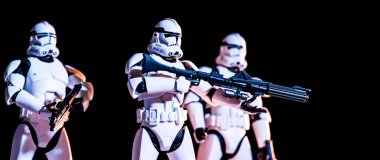 white imperial stormtroopers with guns isolated on black, banner 