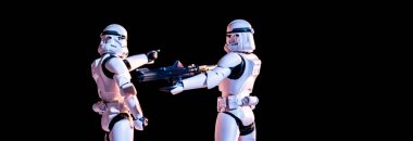 toy white imperial stormtroopers with gun isolated on black clipart