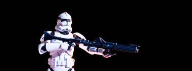 white imperial stormtrooper with gun isolated on black
