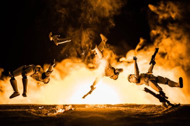 plastic Imperial Stormtrooper levitating in air on black background with explosion 