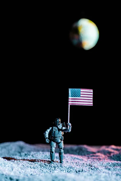 Toy Soldier Holding National American Flag Space Planet Earth Black — Stock Photo, Image