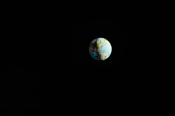 planet Earth with shadow in space isolated on black