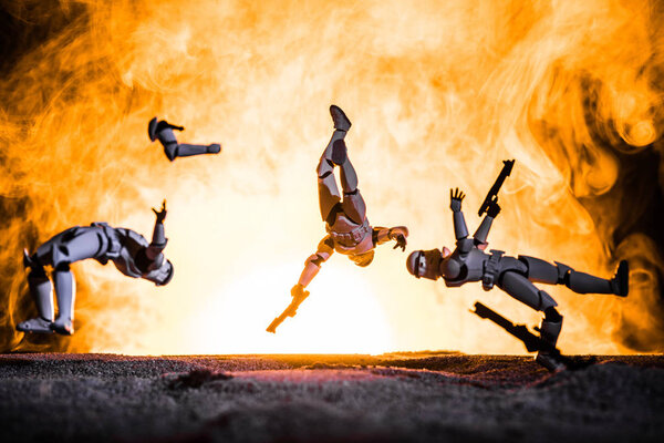 white plastic Imperial Stormtrooper levitating in space in front of explosion