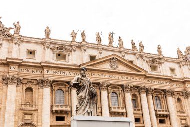 ROME, ITALY - JUNE 28, 2019: exterior of basilica of saint peter under grey sky clipart