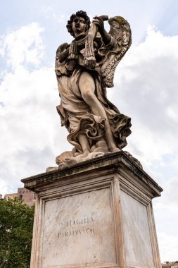 ROME, ITALY - JUNE 28, 2019: ancient roman statue under blue sky clipart