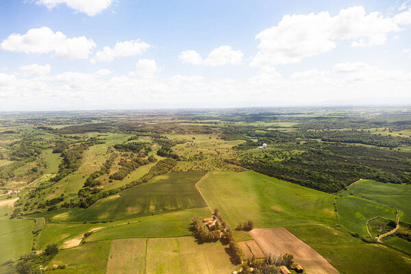 aerial view of beautiful landscape with green hills under blue sky with clouds in rome, italy