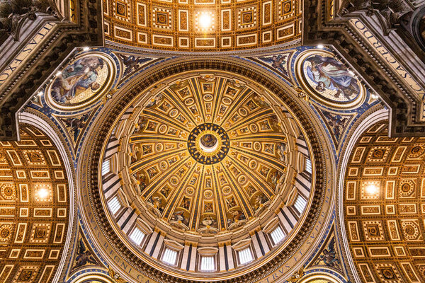 ROME, ITALY - JUNE 28, 2019: bottom view of ceiling with old frescoes in vatican museum