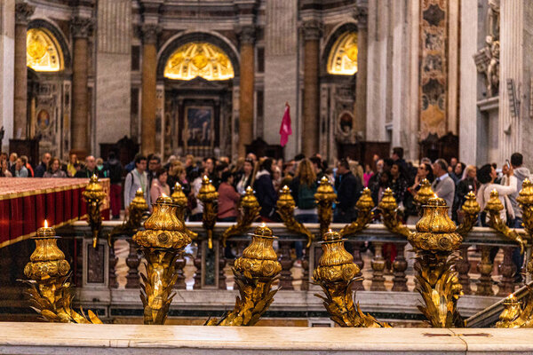 ROME, ITALY - JUNE 28, 2019: selective focus of people in basilica of saint peter in vatican