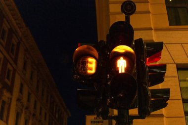 traffic light on street in evening in rome, italy clipart