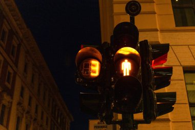 traffic light on street in evening in rome, italy clipart