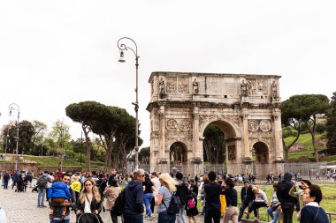 ROME, ITALY - JUNE 28, 2019: crowd of tourists near arch of Constantine clipart