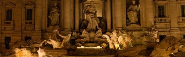ROME, ITALY - JUNE 28, 2019: panoramic shot of fountain and antique sculptures near ancient building in evening clipart
