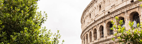 ROME, ITALY - JUNE 28, 2019: panoramic shot of old ruins of colosseum