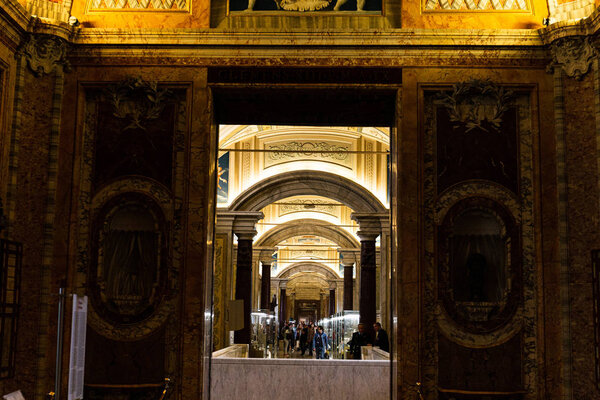 ROME, ITALY - JUNE 28, 2019: crowd of tourists walking in old museum with exhibition