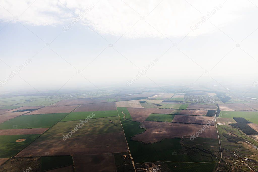 aerial view of fields under clouds in rome, italy