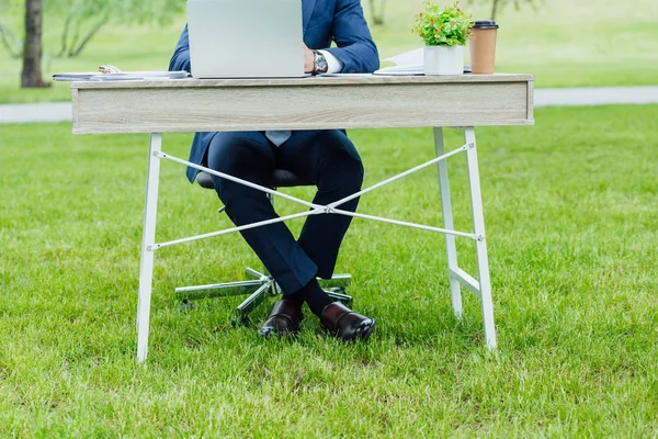 Cropped View Young Businessman Using Laptop Sitting Table Crossed Lags — Stock Photo, Image