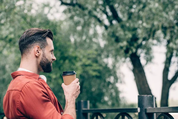 Side View Man Sitting Park Drinking Coffee Paper Cup Looking — Stock Photo, Image