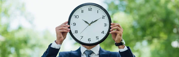 Panoramic Shot Businessman Covering Face Clock While Standing Park — Stock Photo, Image