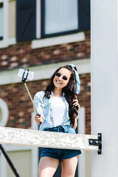 Attractive Woman Holding Selfie Stick Taking Selfie Smartphone — Stock Photo, Image